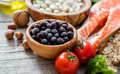 Salmon, berries, nuts, tomatoes, grains and other healthy food.