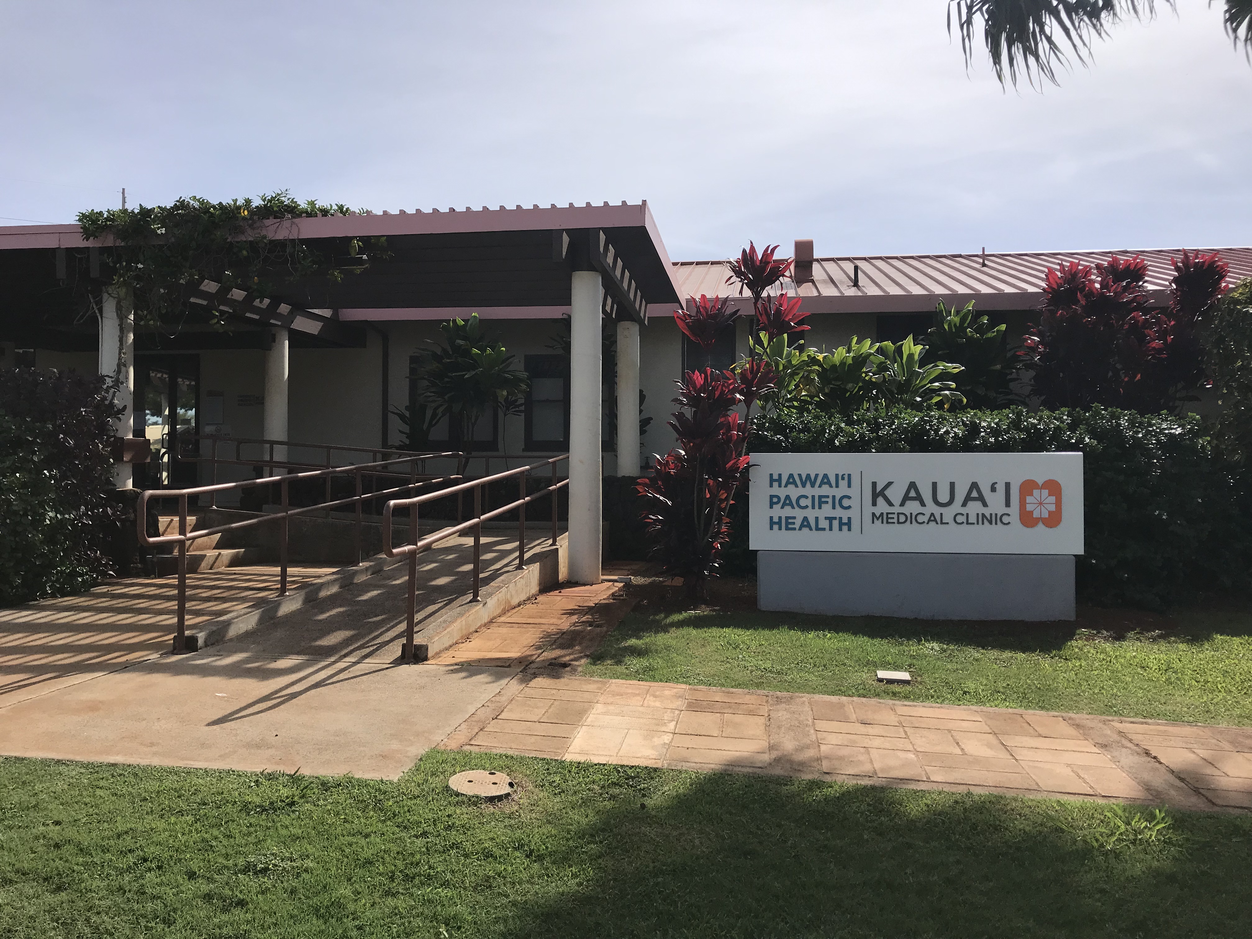 Exterior of the Kauai Medical Center Eleele Clinic with ramp to entrance and signage.