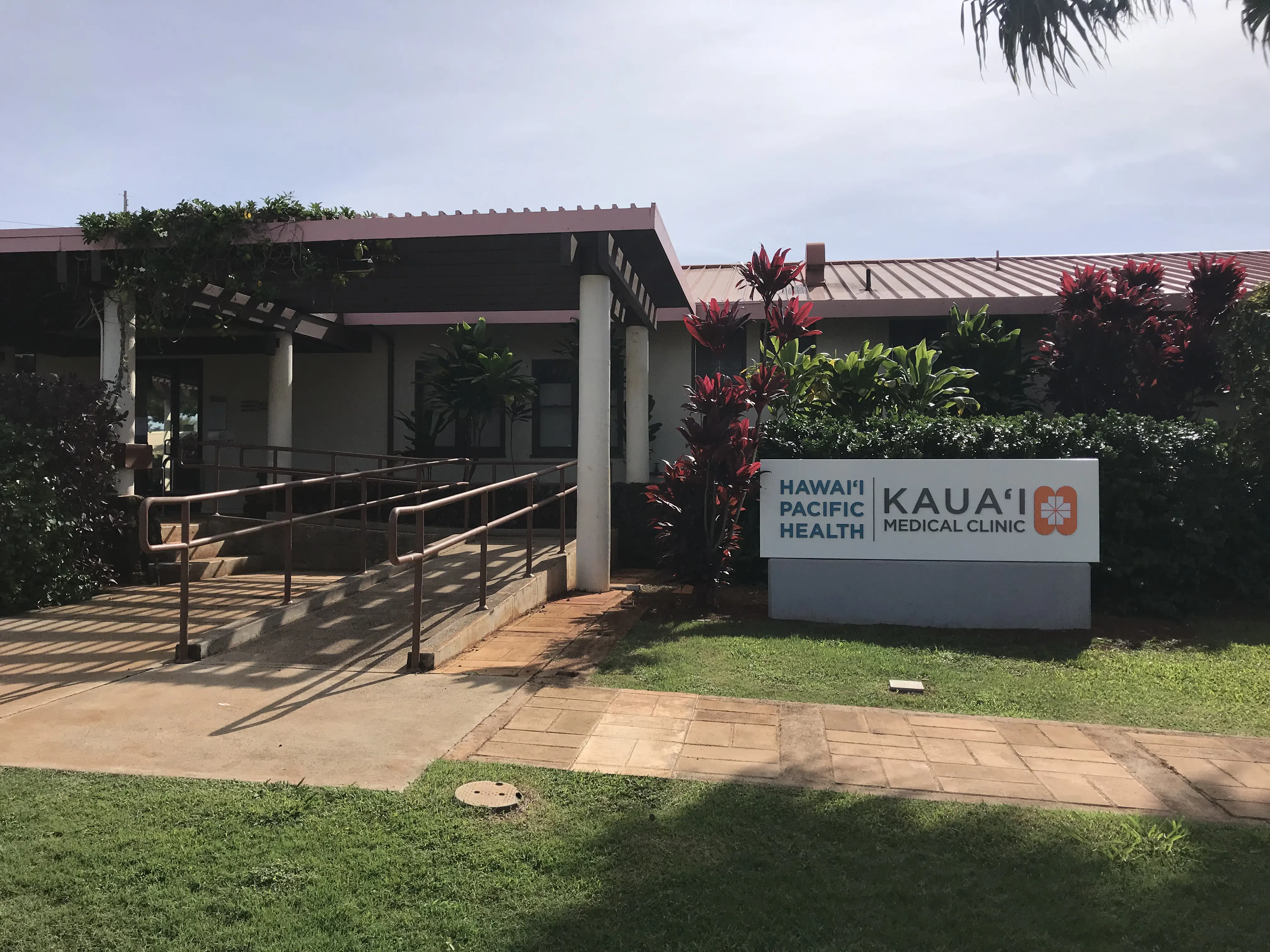 Exterior of the Kauai Medical Center Eleele Clinic with ramp to entrance and signage.