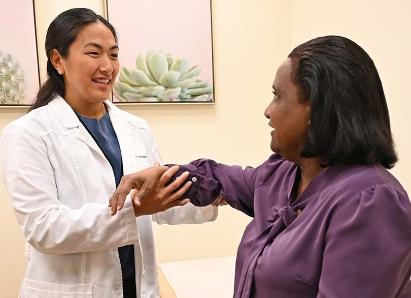 Doctor with a patient at the Kapiʻolani Women's Bone & Joint Clinic.